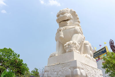 Low angle view of statue against sky