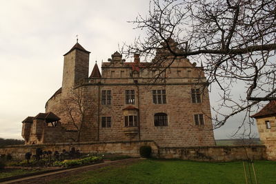 Low angle view of historic building against sky