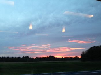 Scenic view of field against sky at night