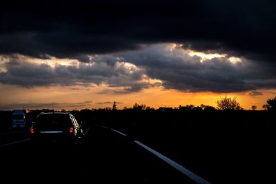 Dramatic sky over road at sunset