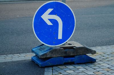 High angle view of road sign on street