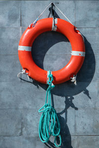 High angle view of rope tied on wall