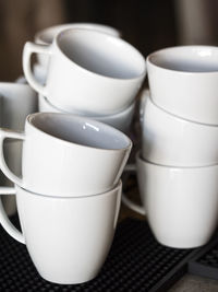 Close-up of empty coffee cups on table