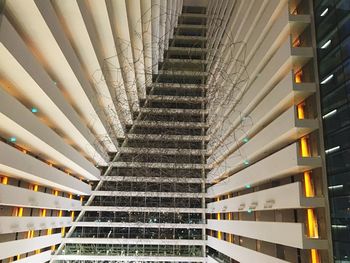 Low angle view of illuminated staircase in building