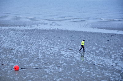 People jumping in sea