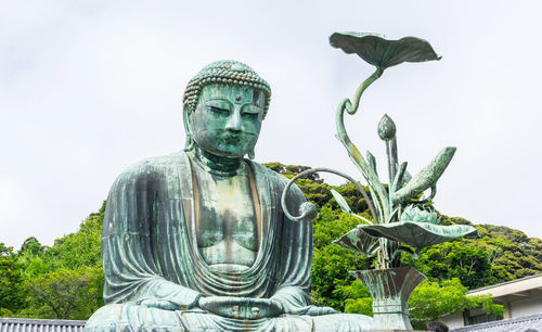 Low angle view of statue against the sky