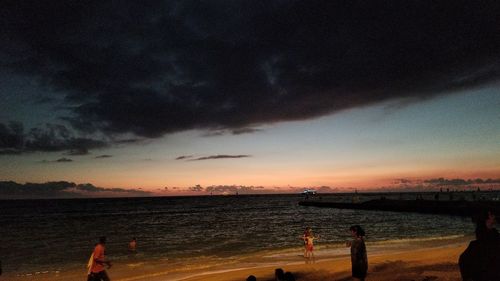 Scenic view of sea against sky at sunset