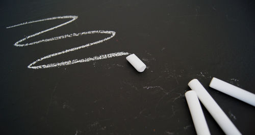 High angle view of text written on black background