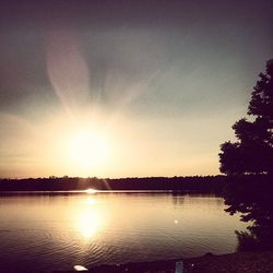 Scenic view of lake at sunset