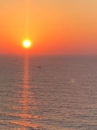 Scenic view of sea against romantic sky at sunset