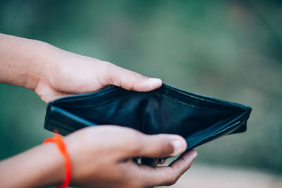 Close-up of hand empty wallet