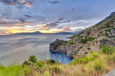 Scenic view of sea against cloudy sky