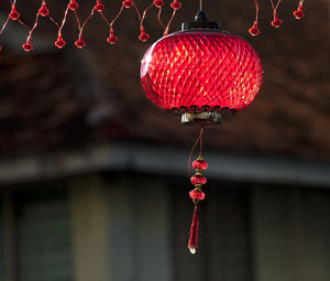 Low angle view of lantern hanging at doorway