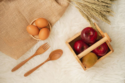High angle view of fruits in basket on table