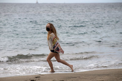 Full length of woman on beach