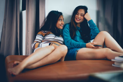 Young woman sitting at home