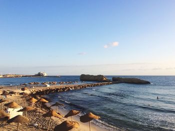 Scenic view of sea against clear blue sky