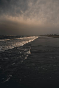 Scenic view of sea against sky at sunset