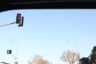 Low angle view of street light against sky