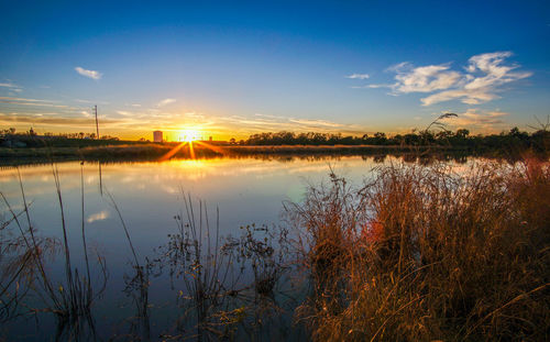 Scenic view of lake at sunset