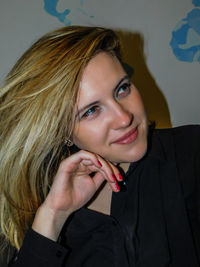 Close-up portrait of smiling young woman