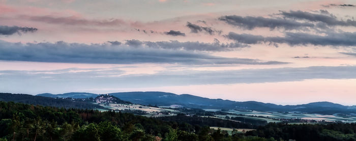 Scenic view of mountains against sky during sunset