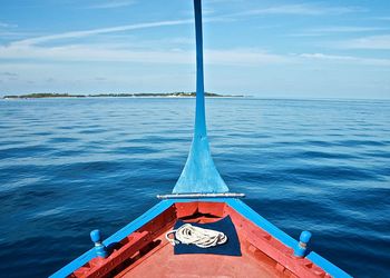 Cropped image of boat on sea against sky