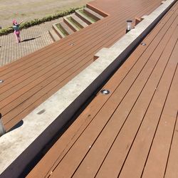 High angle view of man walking on footpath