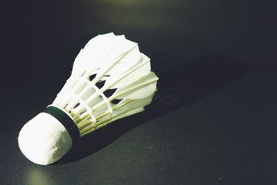 High angle view of umbrella on table against black background