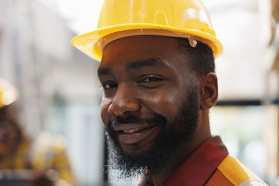 Close-up of young man wearing hat