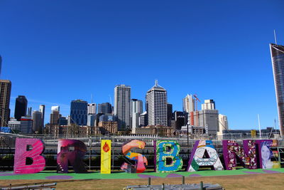 View of cityscape against blue sky