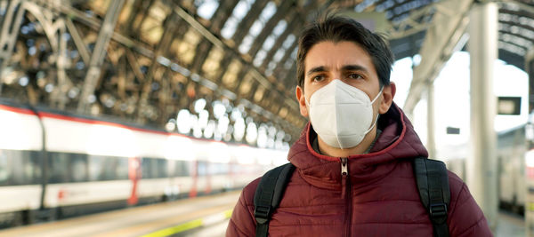 Man wearing mask standing outdoors