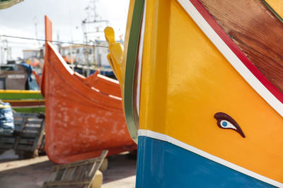 Close-up of yellow ship in city