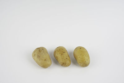 Close-up of fruits against white background