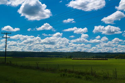 Scenic view of landscape against cloudy sky