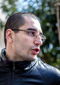 Close-up of young man looking away