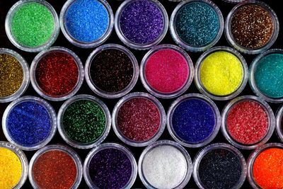 High angle view of colorful glitters on table