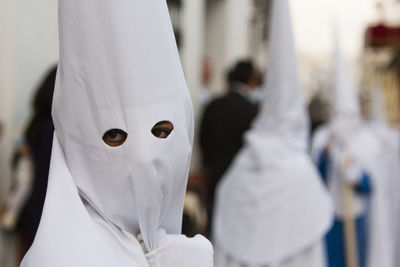 Person wearing white mask