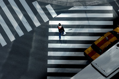 High angle view of person crossing road