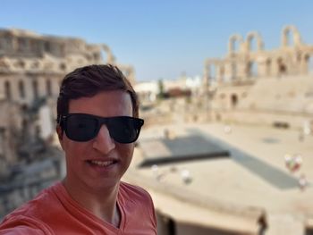 Portrait of smiling man in sunglasses outdoors