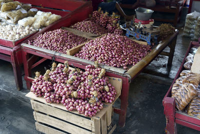 Shallots sold at street vendor in glagah beach in kulonprogo, indonesia. street photography.