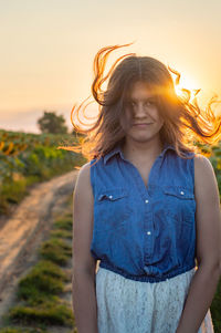 Young woman in sunflower farm