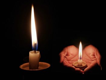 Close-up of lit candle in darkroom