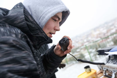 Portrait of young man photographing