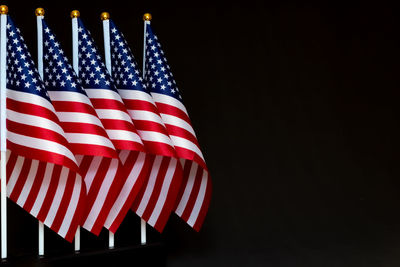 Low angle view of flag against black background
