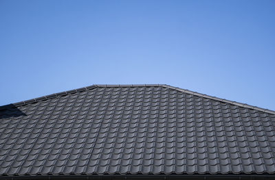 Low angle view of building against blue sky