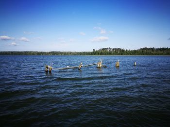 Scenic view of lake against blue sky
