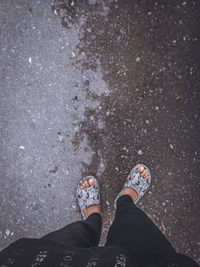 Low section of person standing on street