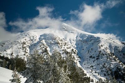 Snow covered mountains against sky