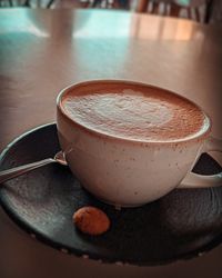 Close-up of coffee cup on table